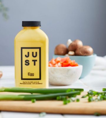 JUST egg bottle next to a chopping board and vegetables