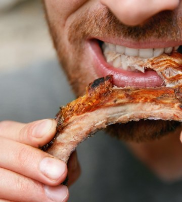 A man eating meat