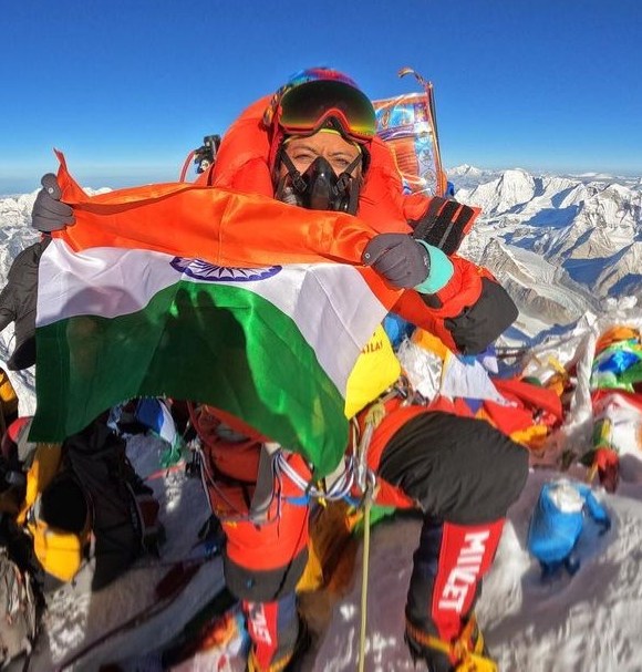 Prakriti Varshney holds the Indian flag at the top of Everest