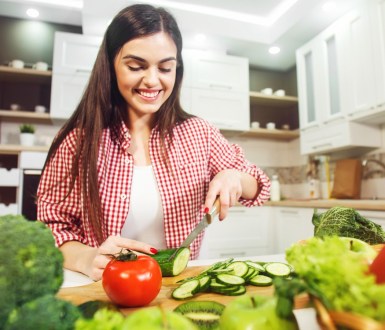 Woman cutting vegetables in the kitchen